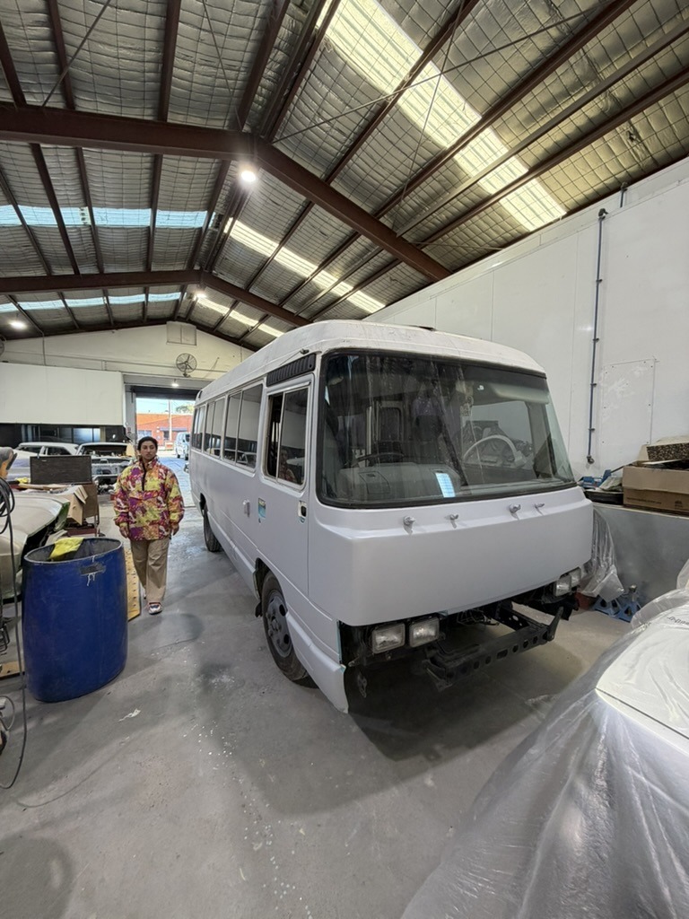 The expedition bus being worked on inside a vehicle workshop